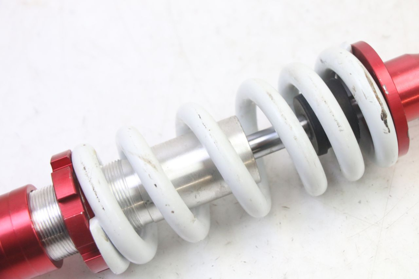 photo de AMORTIGUADOR TRASERO LONCIN DIRT BIKE 125 - Primer plano técnico