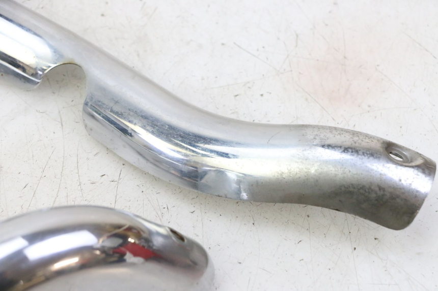 photo de Cárter de escape HYOSUNG GV AQUILA 125 (2000 - 2009) - Estado de la superficie y material